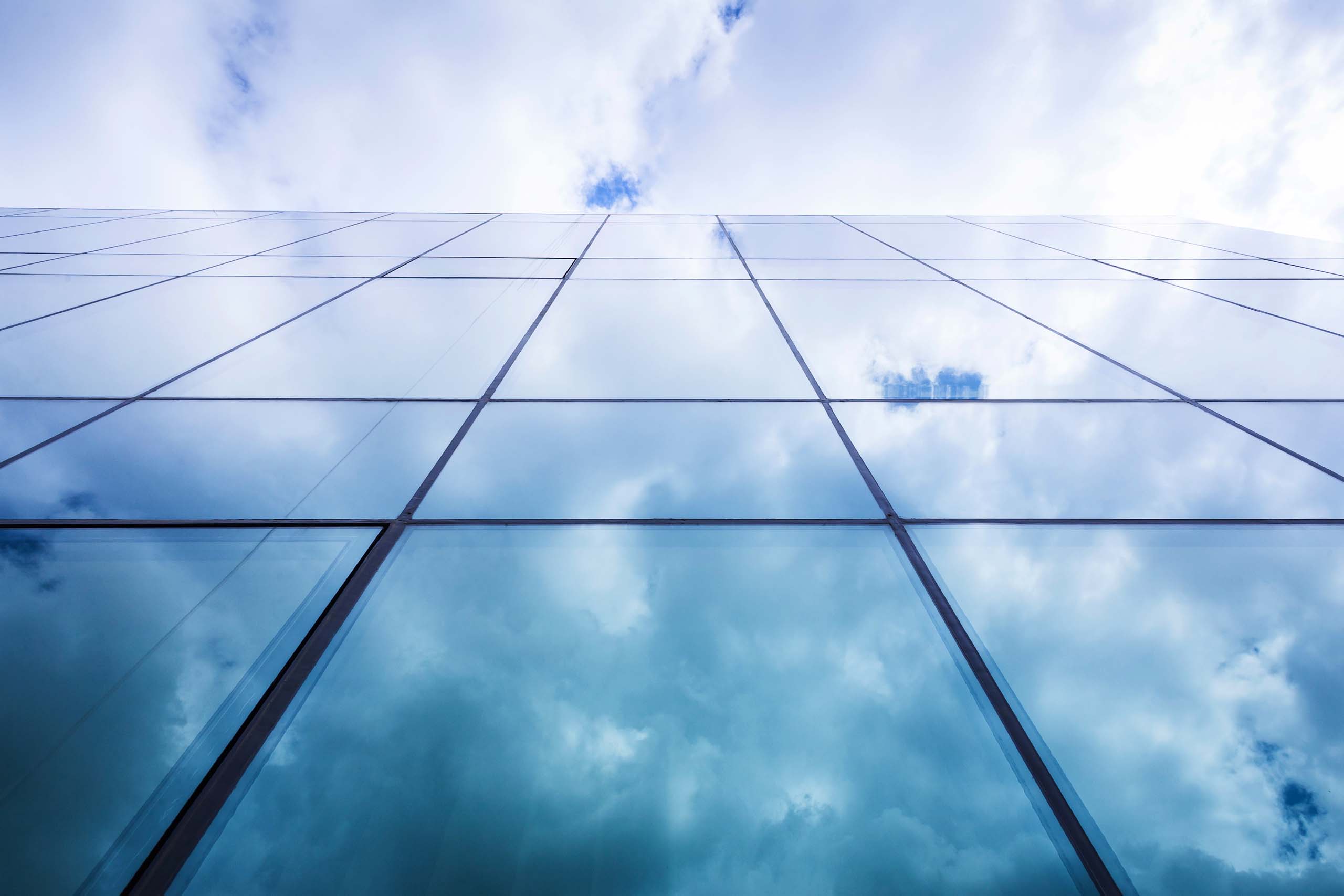 Clouds reflected in glass skyscraper