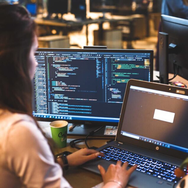 A woman working on her laptop.